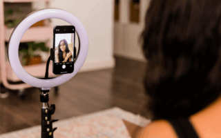 Influencer films video on her phone