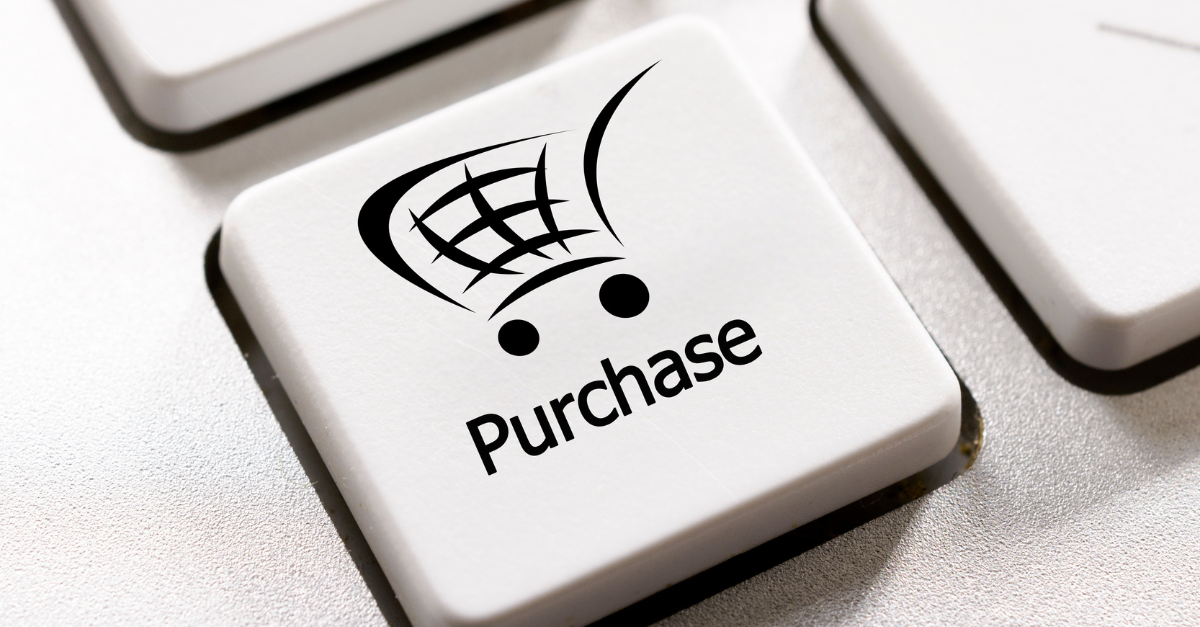 Key on a keyboard that has the image of a shopping trolly on it - under the image is the text 'purchase'.